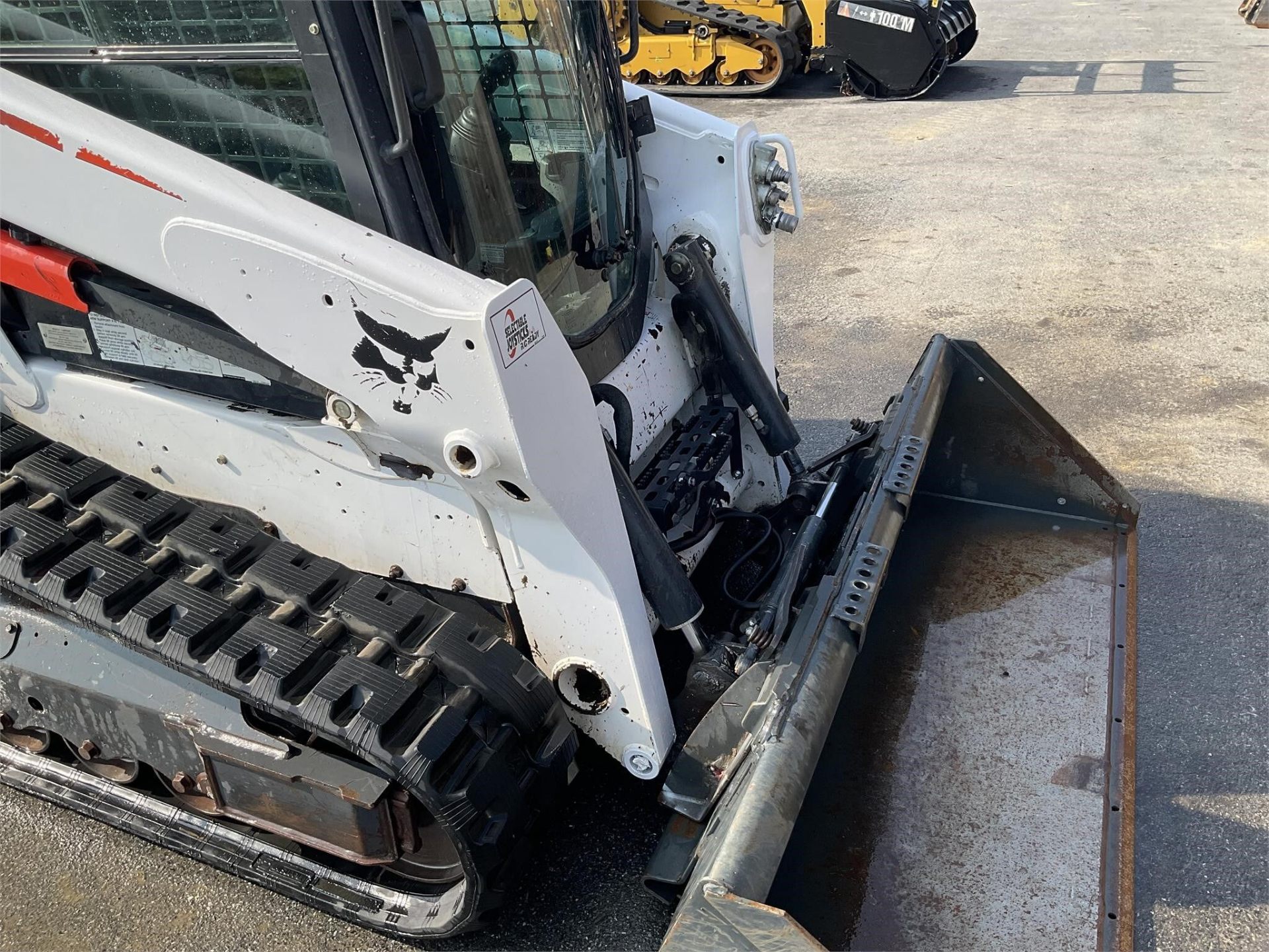 2014 Bobcat T590 — side view with bucket